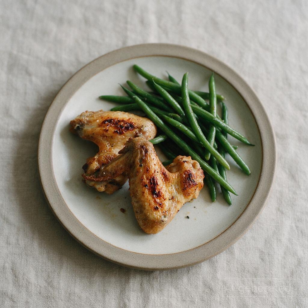 Whole grilled chicken wings with green beans